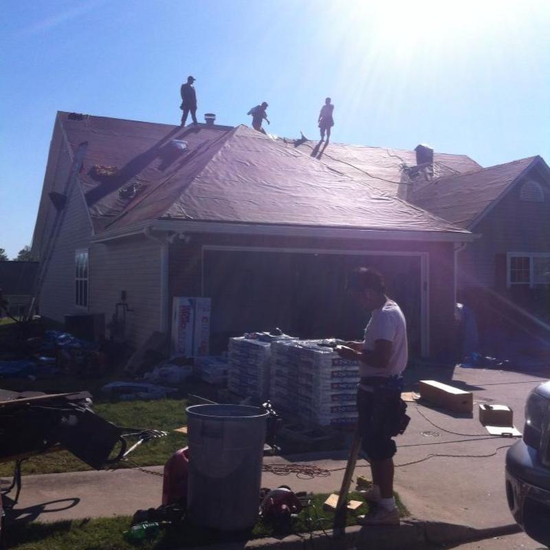 Asphalt shingle roof underlayment installation with crew