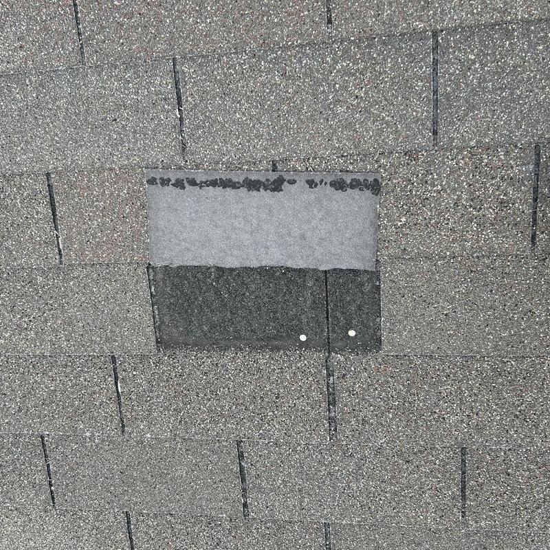 Asphalt roof shingle patch with two nails in North Richland Hills