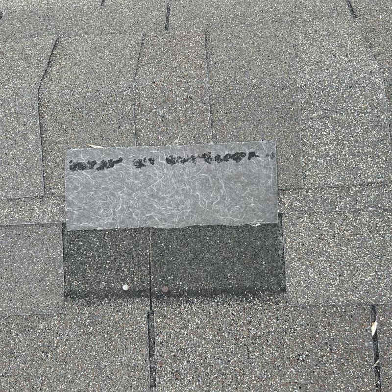 Roof shingles with patch overlay on asphalt shingles