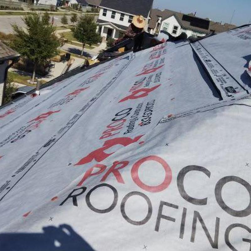 Synthetic roofing underlayment installation on house roof