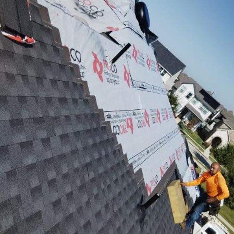 Synthetic underlayment installation on residential roof