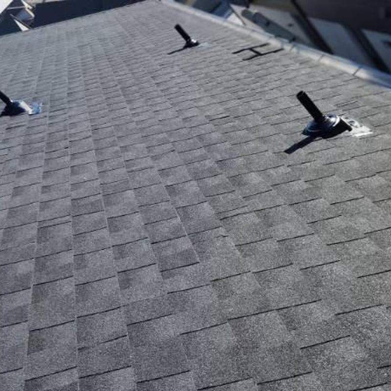 Asphalt shingle roof with vent pipe installations