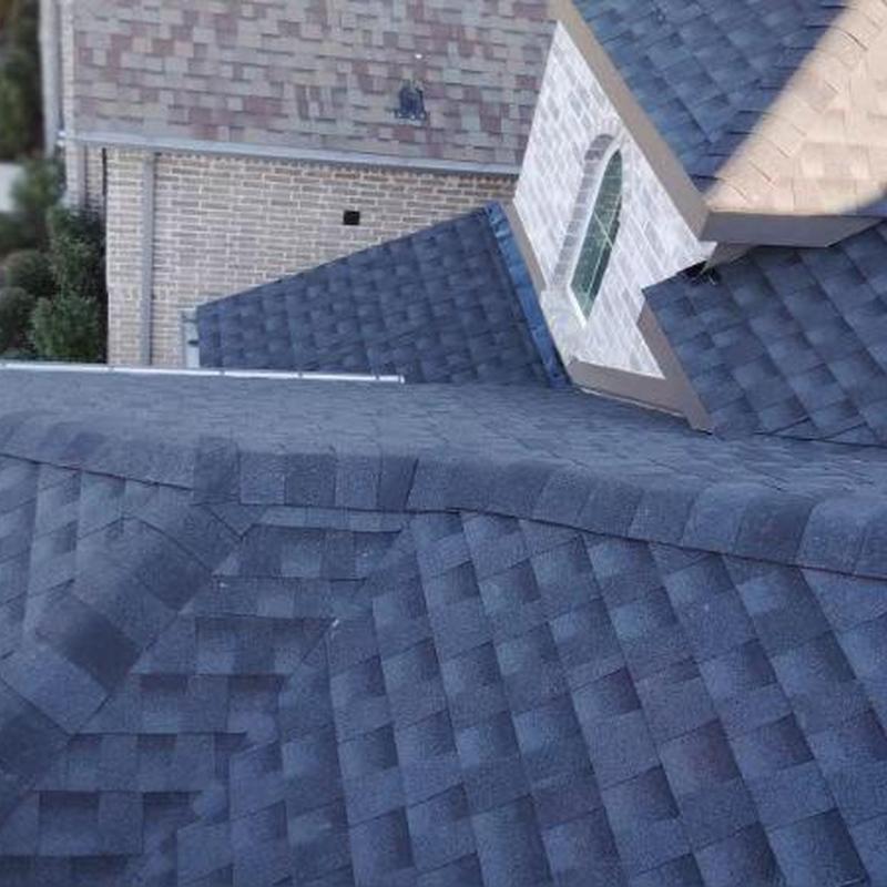 Asphalt shingle roof installation on residential house