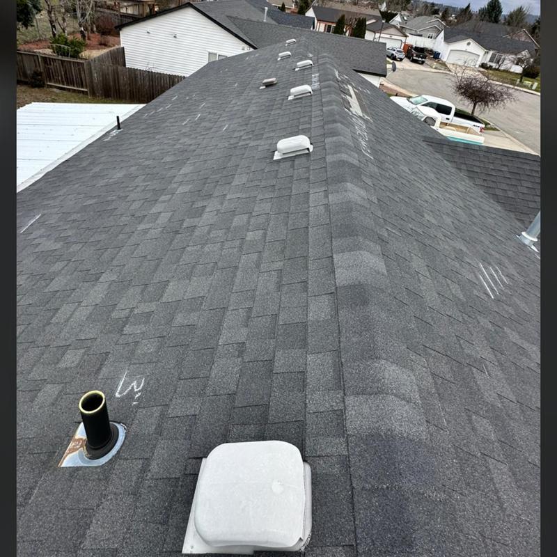 Asphalt shingle roof with wind damage markings