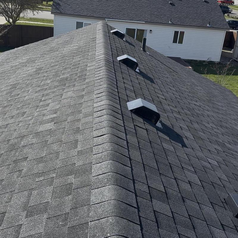 Asphalt shingle roof with ridge vents and vents installed