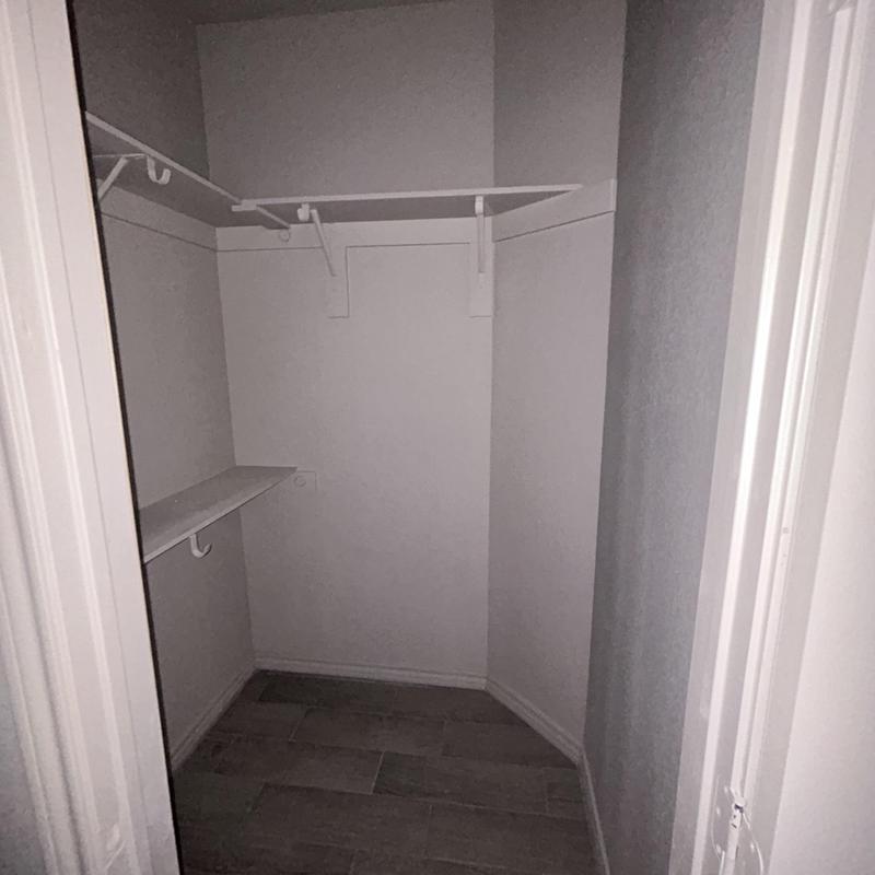 Closet shelving and rod installation in duplex renovation