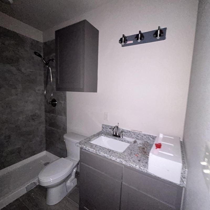 Bathroom vanity with sink and granite countertop