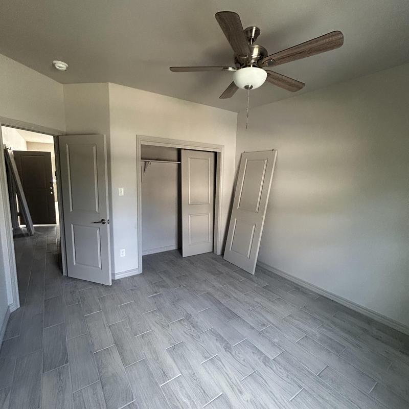 Ceiling fan and room interior with closet doors