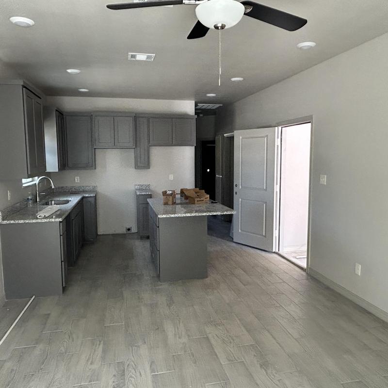 Kitchen cabinets and granite countertops in renovated duplex