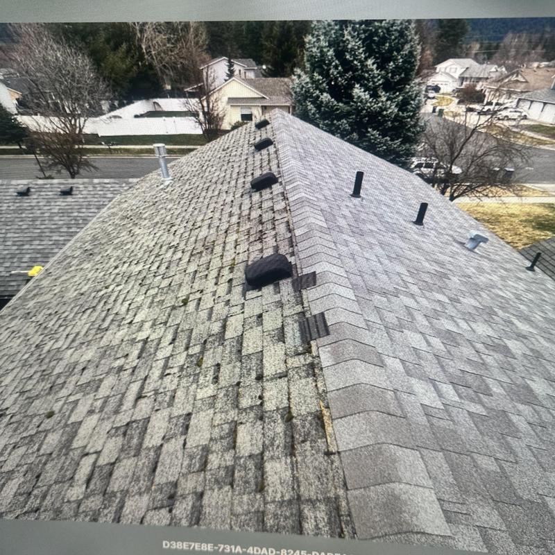 Asphalt roof shingles side-by-side old and new