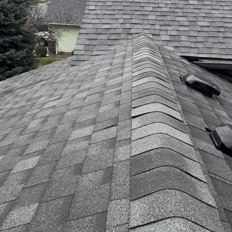 Asphalt shingle roof slopes with new matching shingles