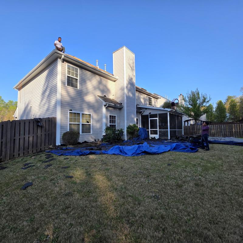 Architectural Duration shingles installation on house roof Architectural Duration shingles installation on house roof