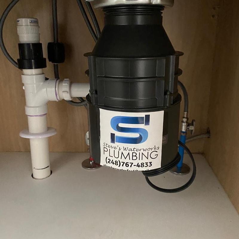 Garbage disposal installation under kitchen sink