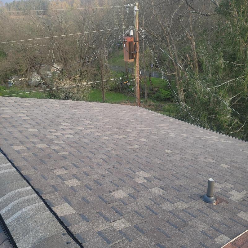 Atlas shingle system on condo roof in Weathered Wood