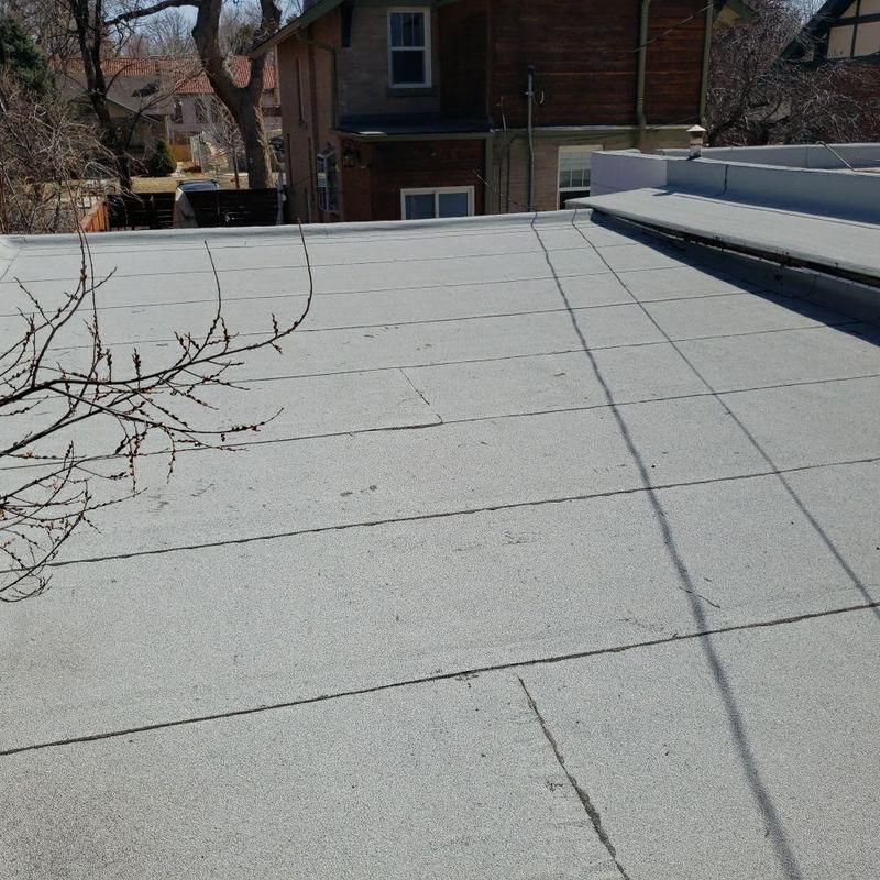 Flat roof surface with visible seams and shadows