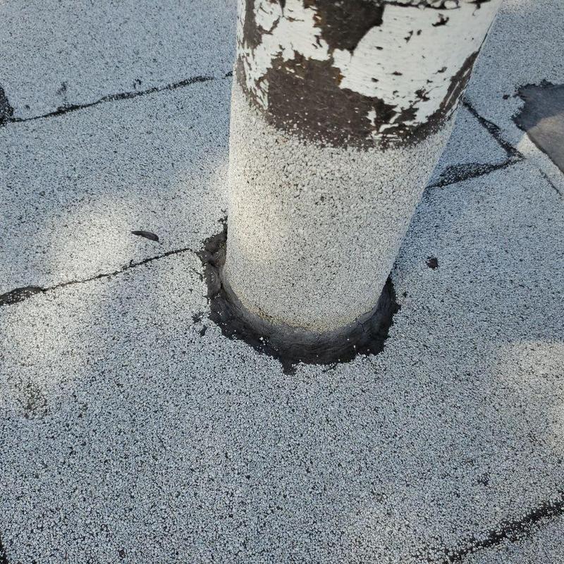 Flat roof pipe jack with cracked flashing sealant