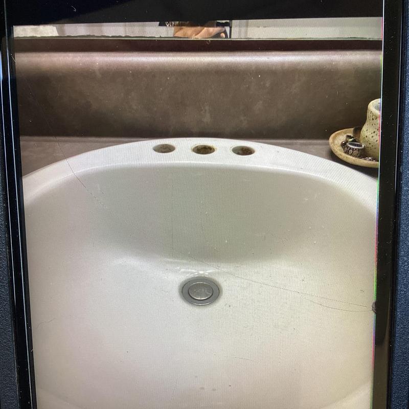 Bathroom sink with missing faucet installation holes