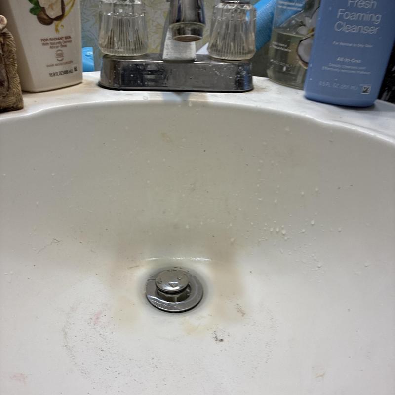 Bathroom lavatory drain with pop-up stopper and faucet