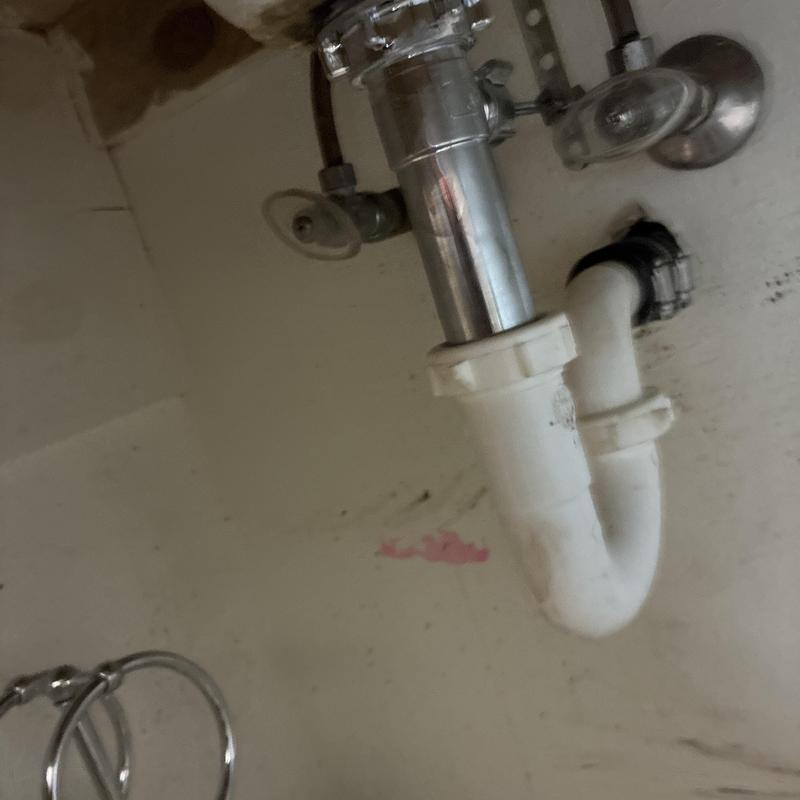 Master bathroom lavatory drain P-trap and pop-up assembly