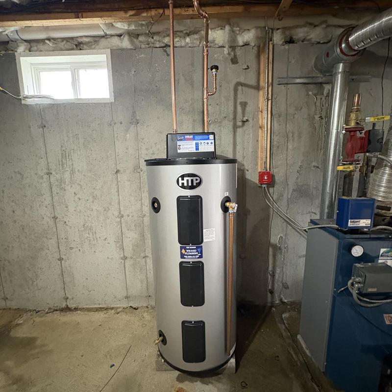 Electric water heater installation with new piping Electric water heater installation with new piping
