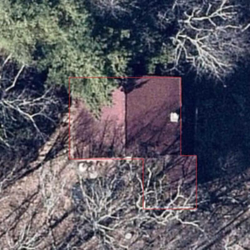 Residential roof aerial inspection with property outline