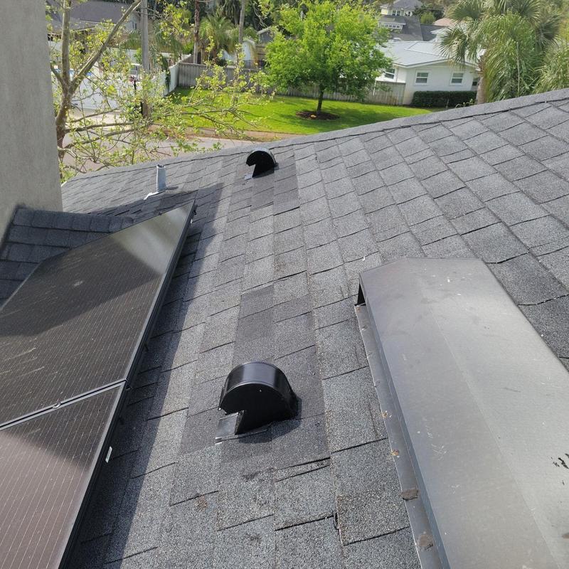 Bathroom roof vent installation on shingle roof