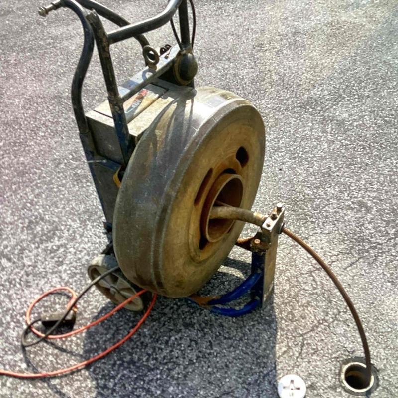 Sewer line drain cleaning machine with cable auger