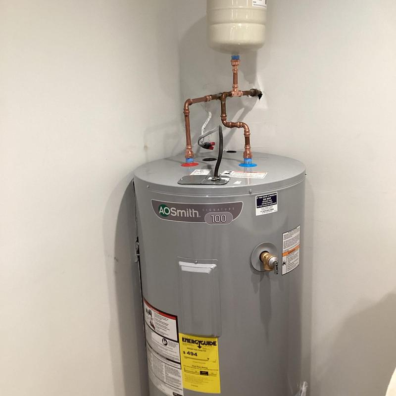 Water heater with new copper supply pipes installed