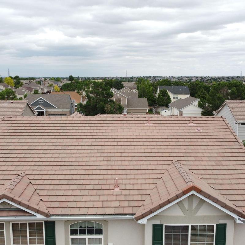 Tile roof with pipe jacks and broken tiles inspection
