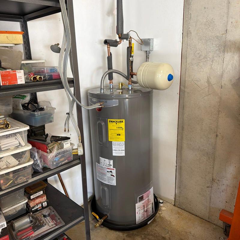 50-gallon electric water heater installation in utility room