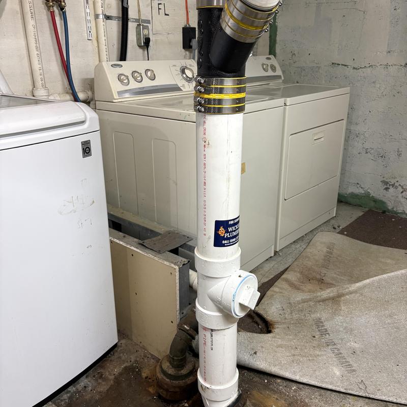 4-inch PVC vertical waste main with cleanout and hanger