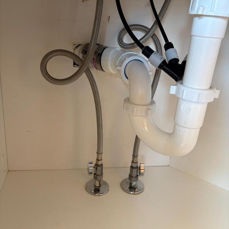Bathroom sink drain and supply valve connections under cabinet