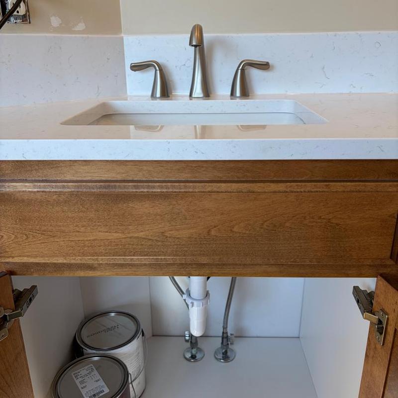 Bathroom sink faucet with countertop and cabinet