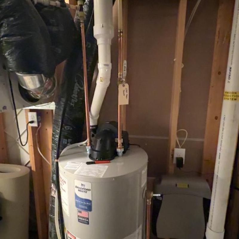 Water heater with copper piping in basement setup