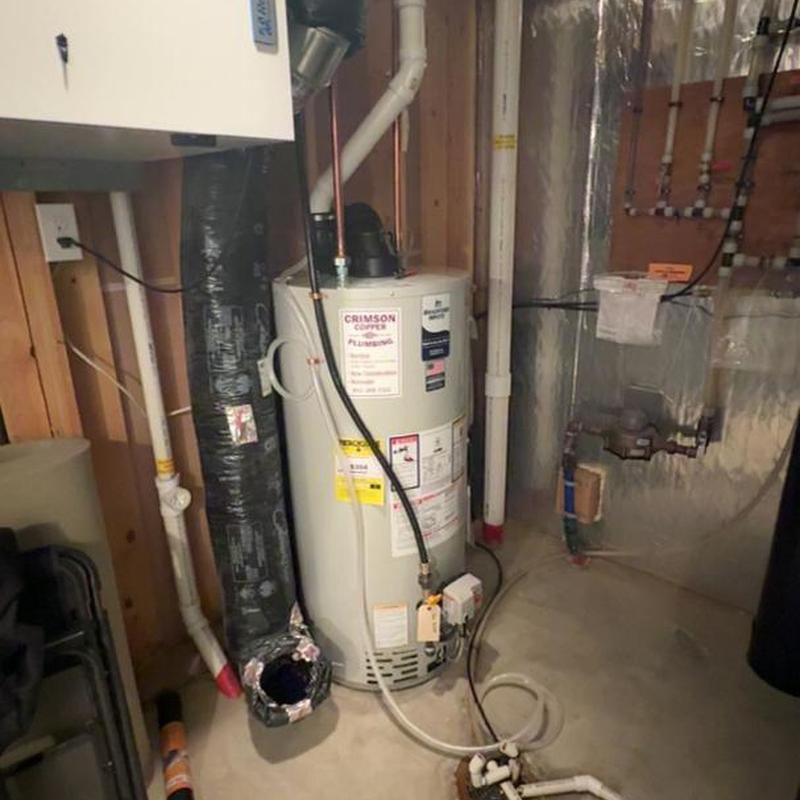 Water heater installation and surrounding plumbing in basement