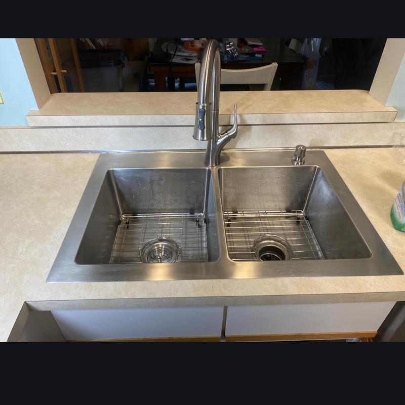 Double-basin stainless steel kitchen sink installation