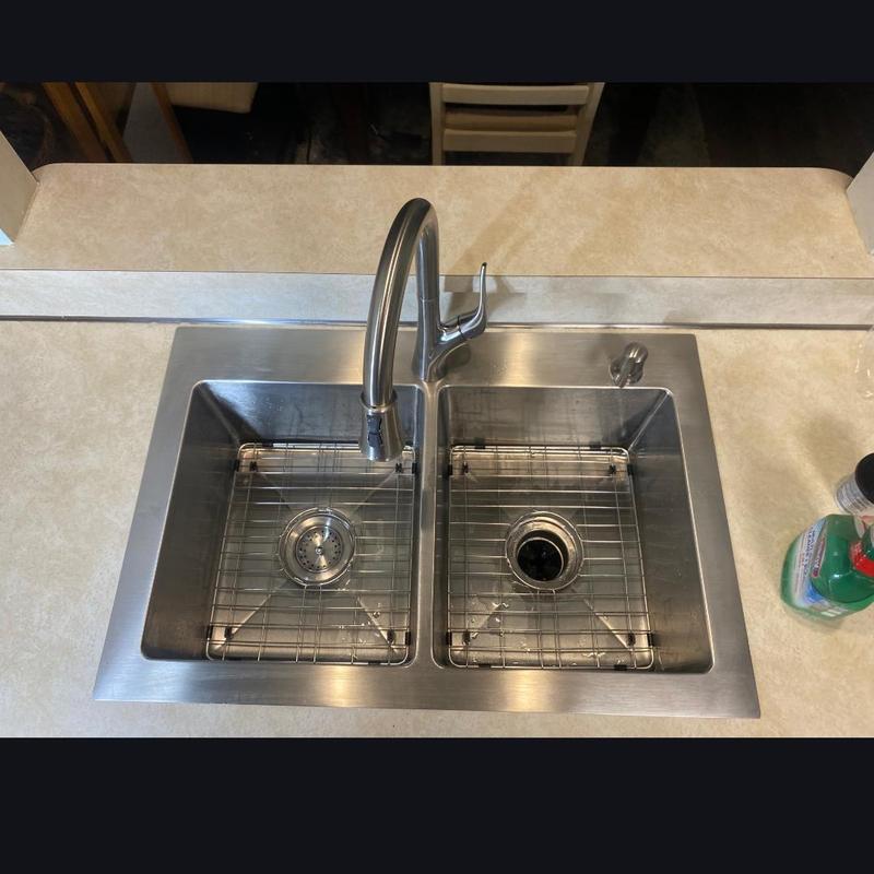 Double-basin stainless steel kitchen sink installation