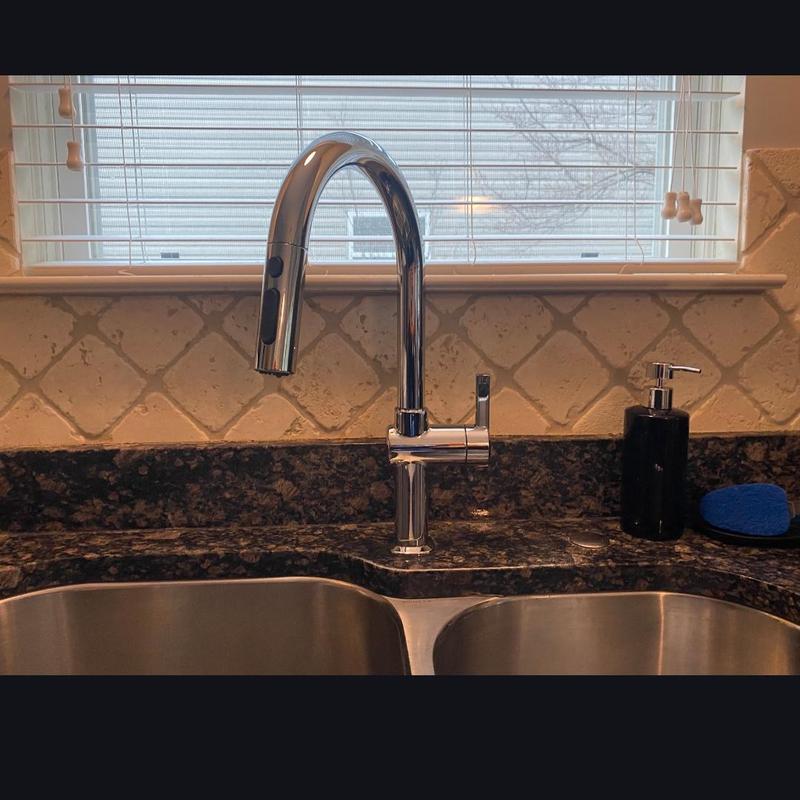 Kitchen faucet installation on granite countertop