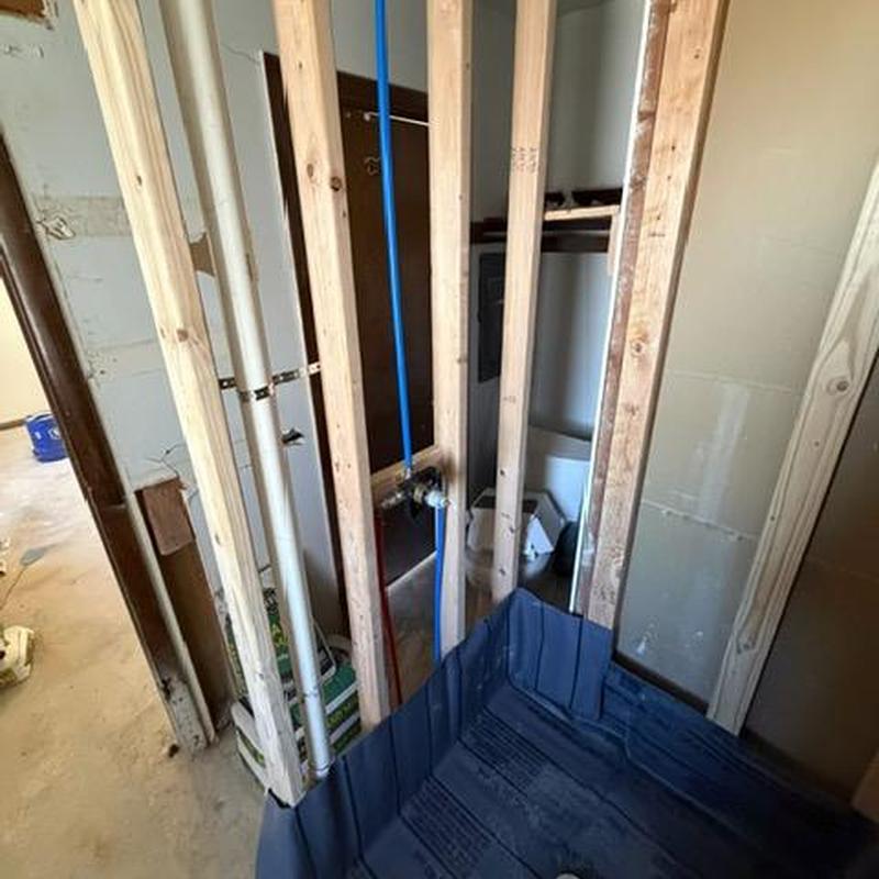 Shower valve rough-in with framing and plumbing lines