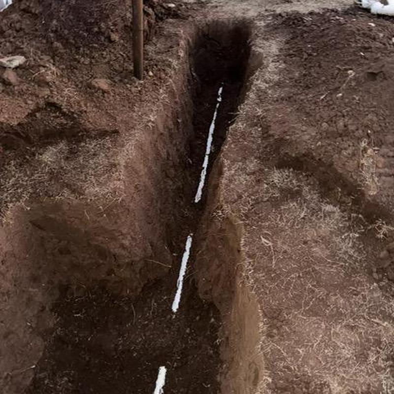 Sewer line trench excavation with installed pipeline