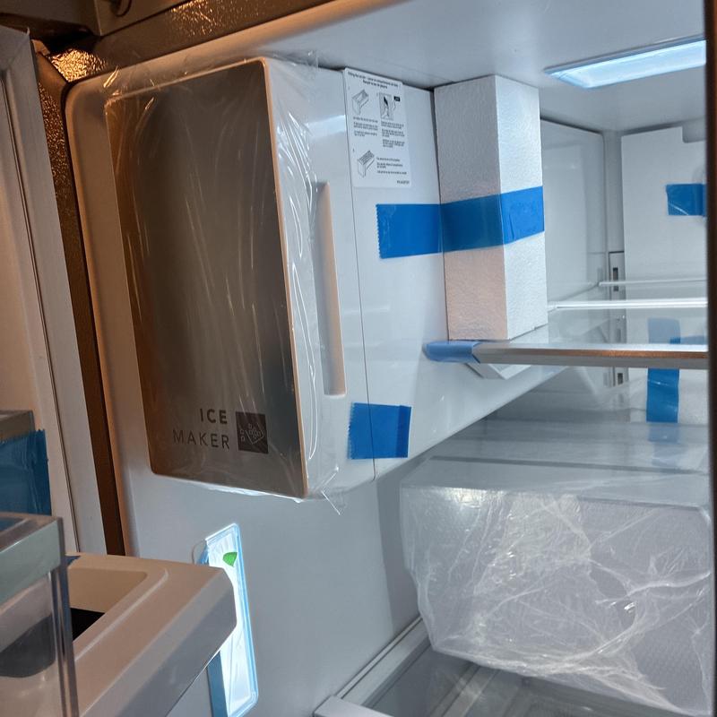 Ice maker assembly installation inside refrigerator unit