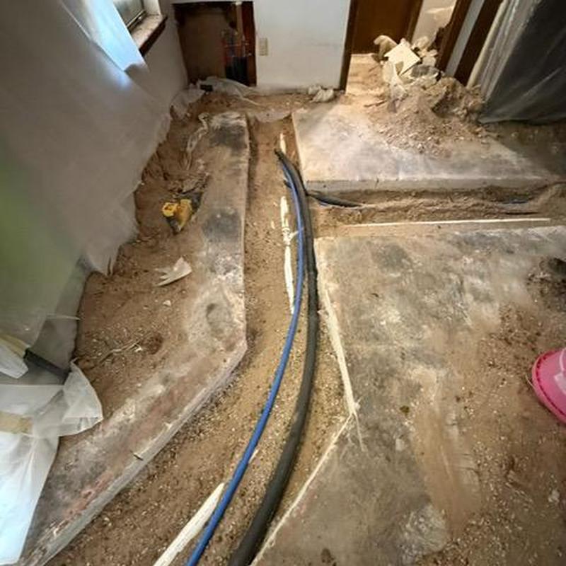 Water and sewer repipe trenches with piping installation