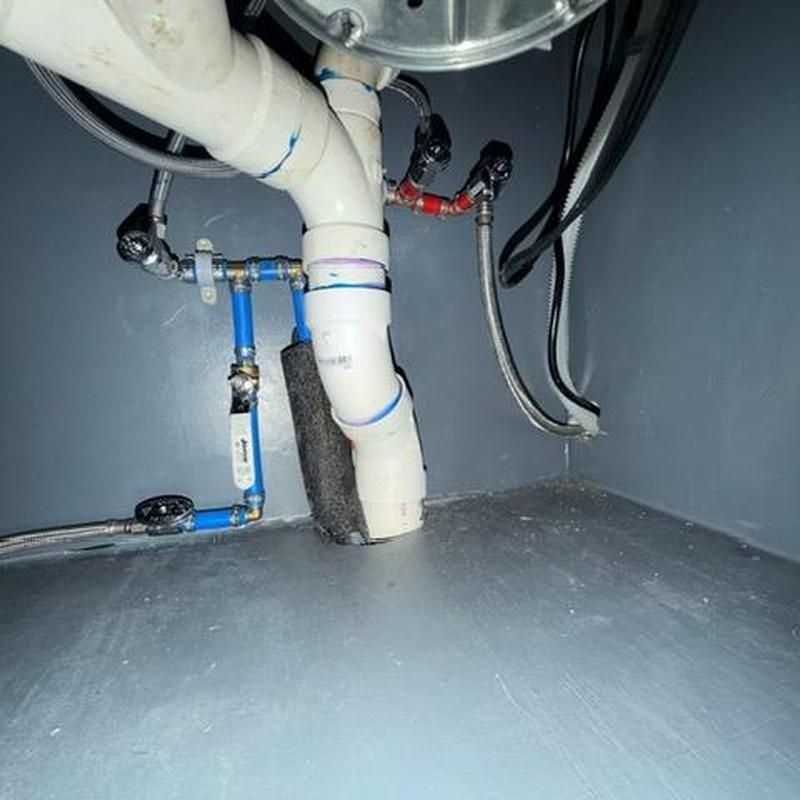 Under sink PVC drain and water line upgrade installation