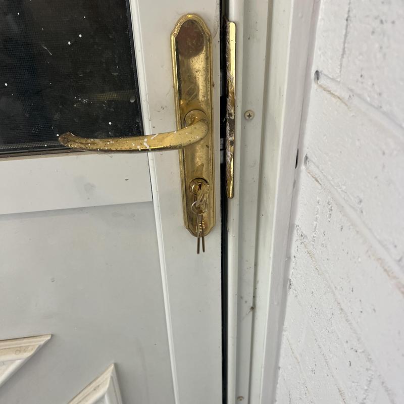 Door lock with keys rekeyed on house door handle