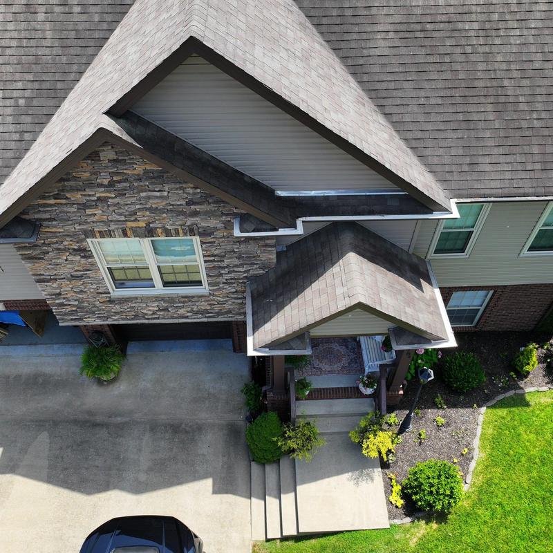 Asphalt shingle roof with hail damage and granule loss