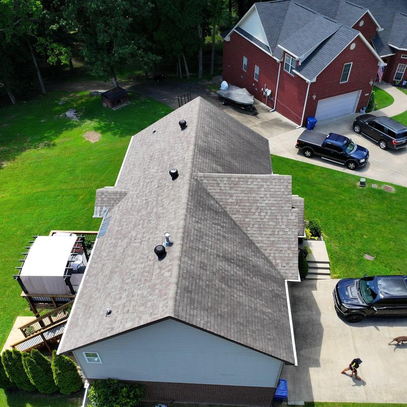 Asphalt shingle roof with ventilators and gutters