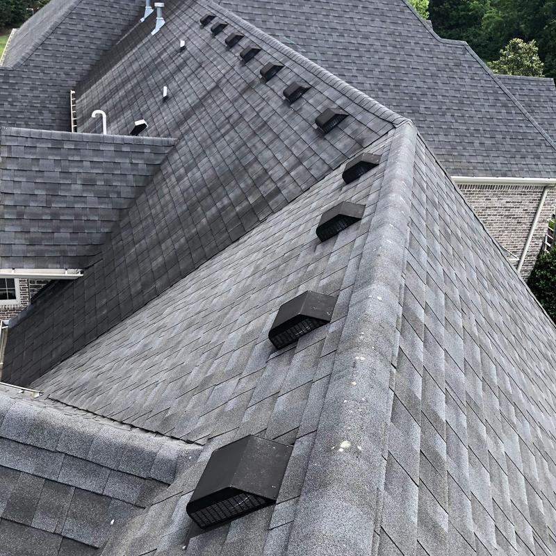 Asphalt shingle roof with ventilation and ridge caps
