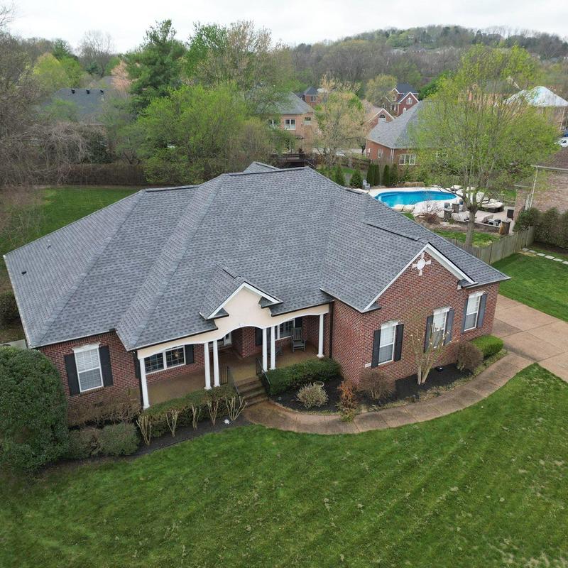 Impact-resistant shingles with flashing on residential roof