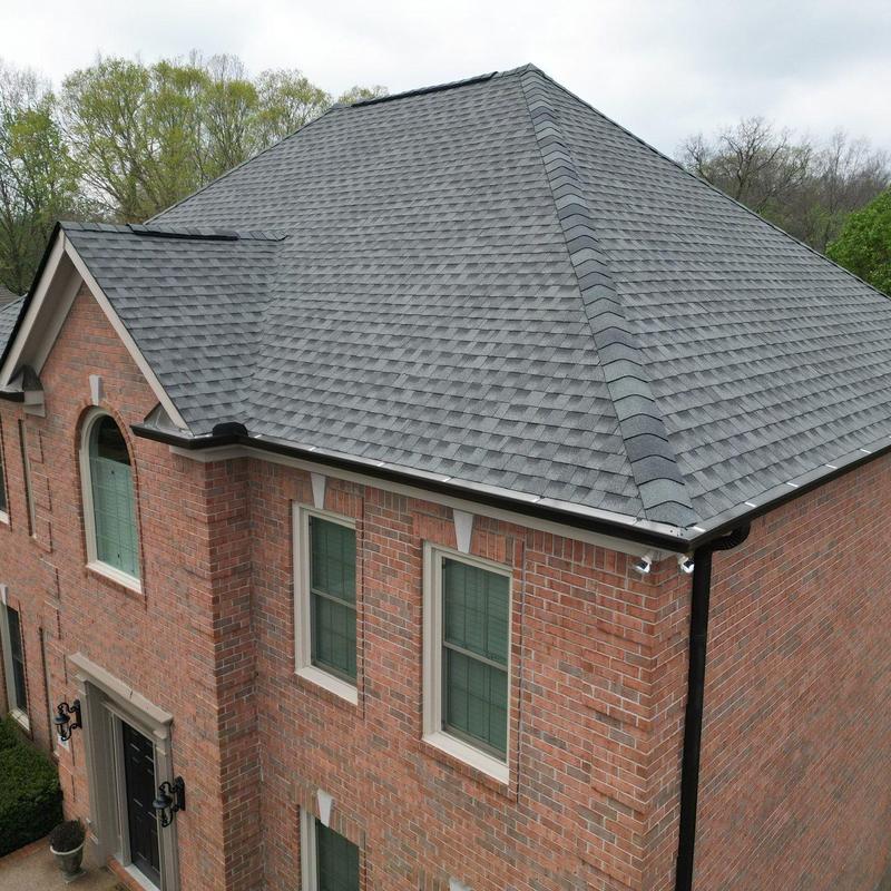 Asphalt shingle roof with hail damage inspection