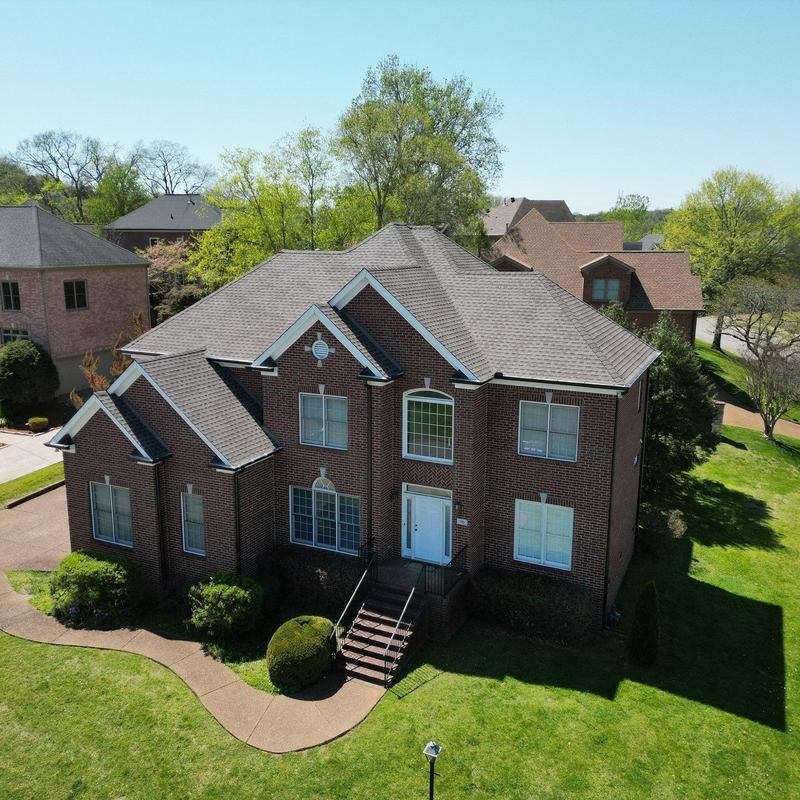 Asphalt shingle roof with visible wear and aging